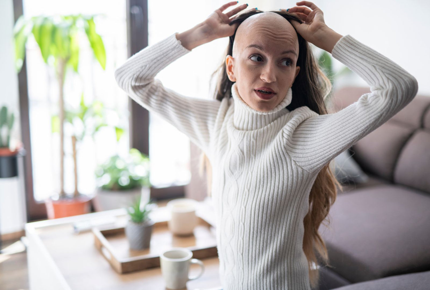 a bald woman with cancer wearing a wig