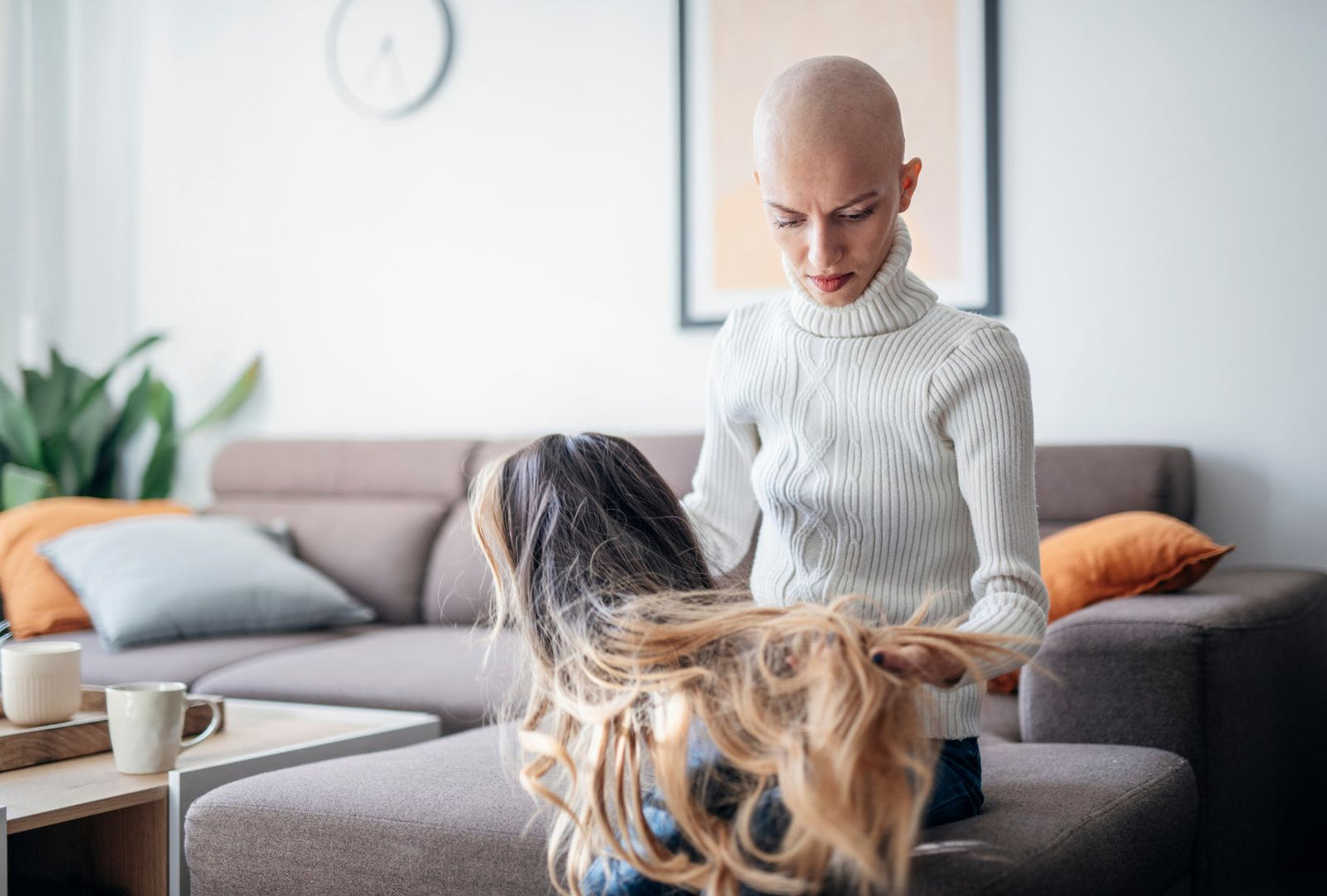 a woman affected with cancer wearing a synthetic wig