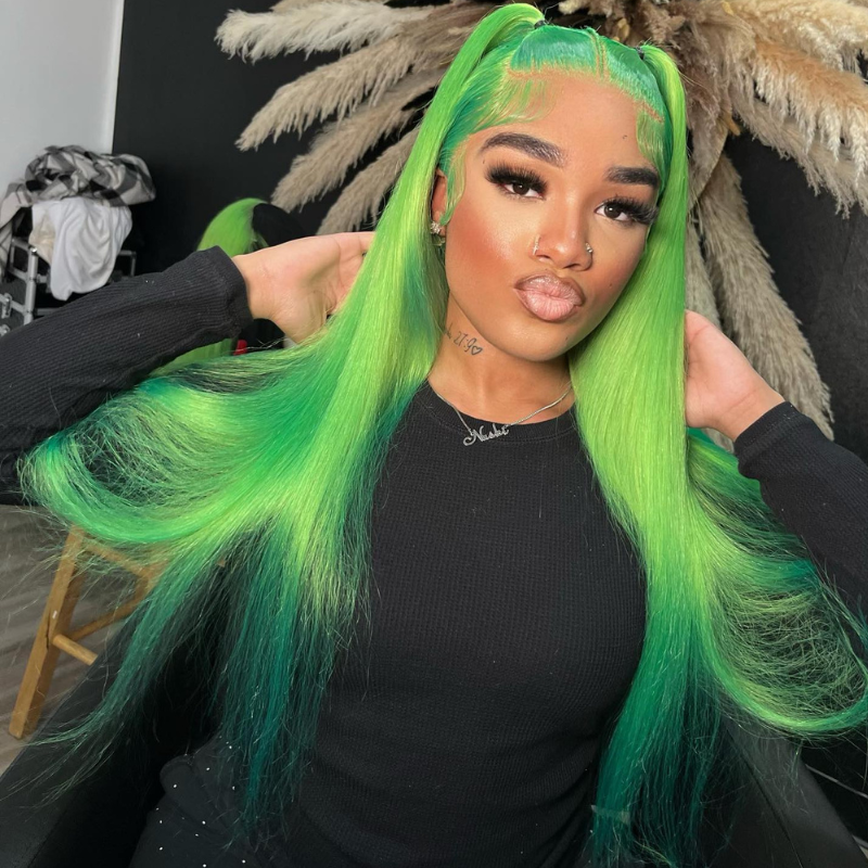 a black woman wearing a green wig